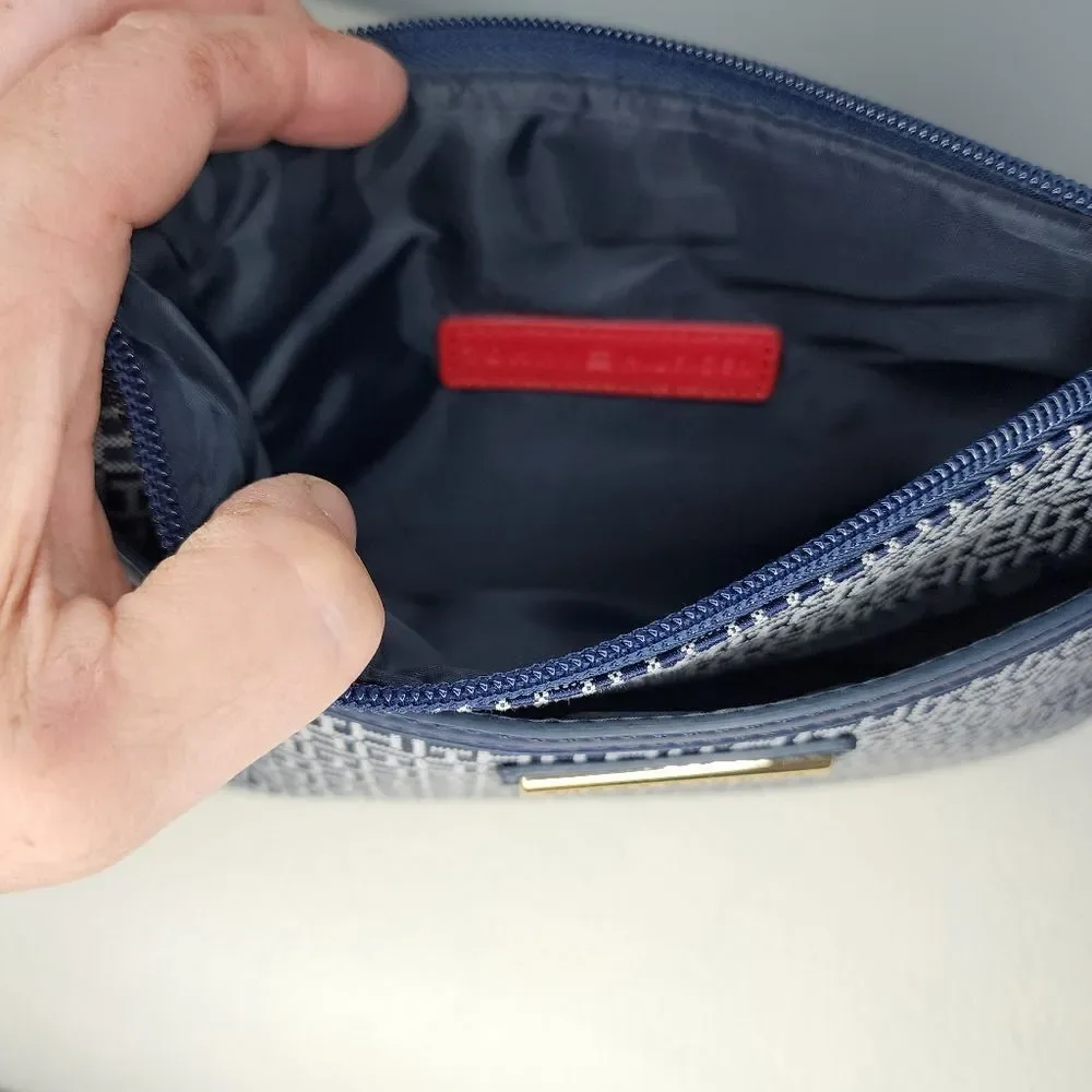 Tommy Hilfiger Wristlet Blue And White with red accents.